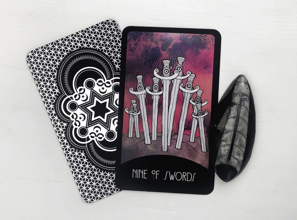 How Do Nine of Swords Cards Influence a Tarot Reading?